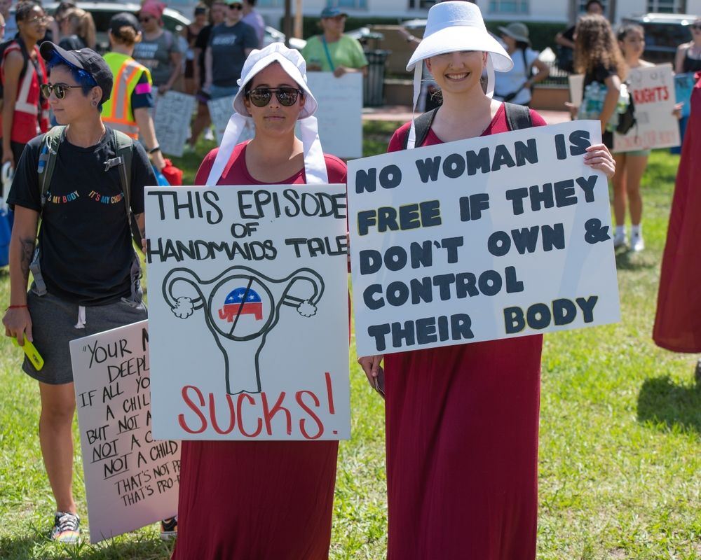 Abortion law protesters wearing Handmaid's Tale costumes