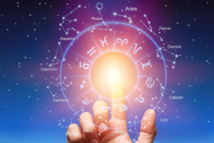 Finger touching astrology symbols in space