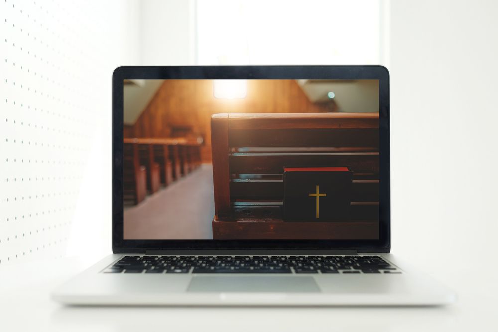The Bible shown on a laptop screen