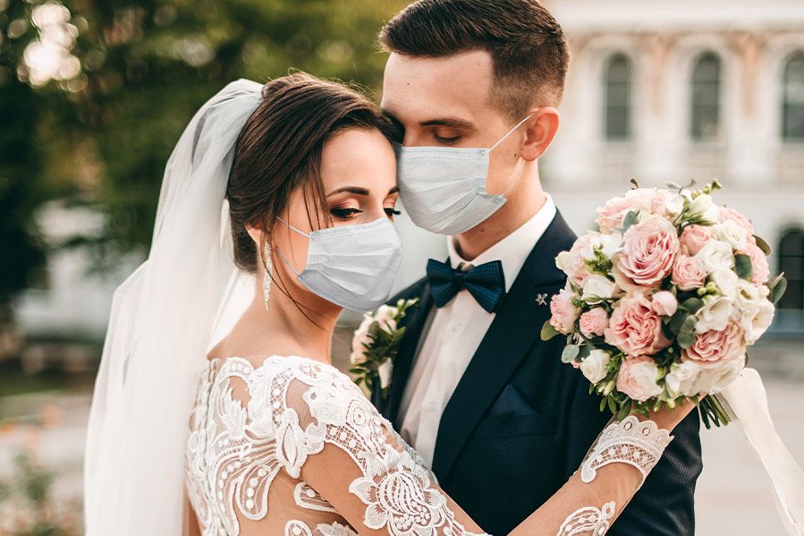 masked bride and groom at COVID wedding