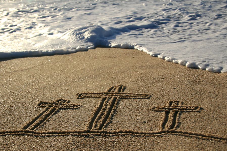 crosses made in sand on beach