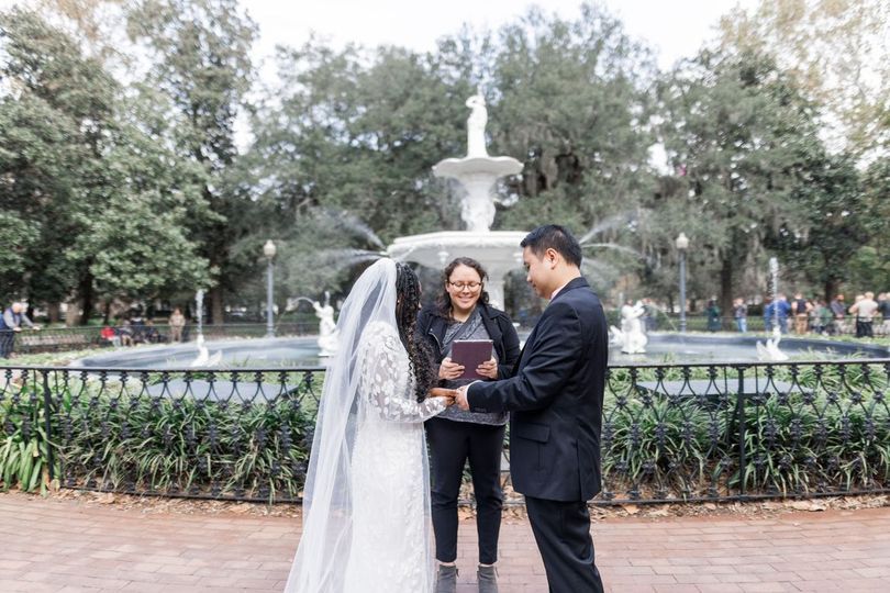 A ULC minister performs a wedding by a fountain