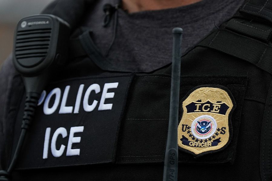 close up of ice agent's uniform, including badge and police insignia