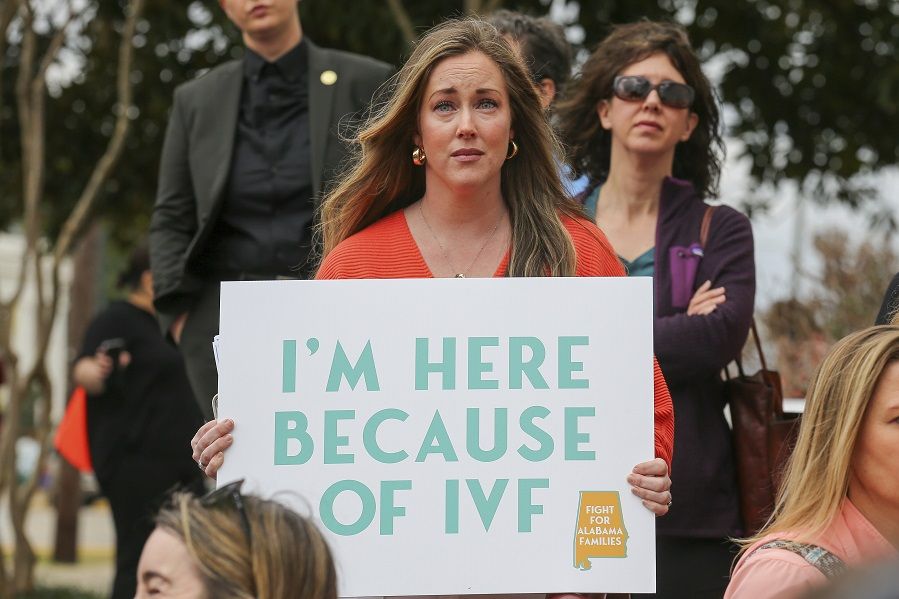 woman protesting for ivf