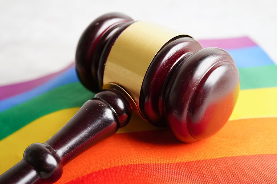 judge's gavel on lgbtq flag