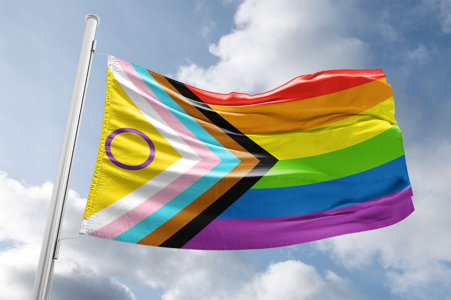 lgbtq pride flag hanging from flagpole