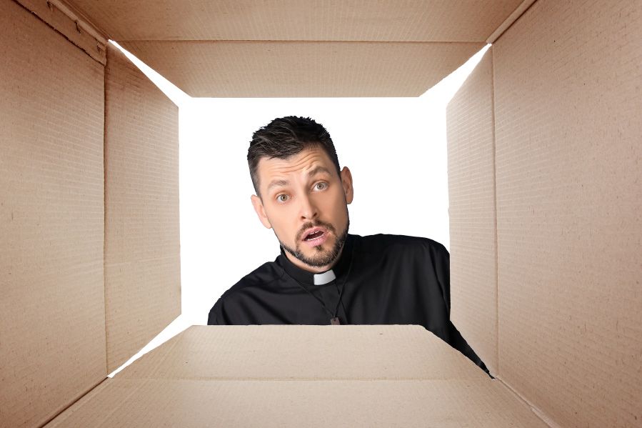 shocked pastor looking inside box