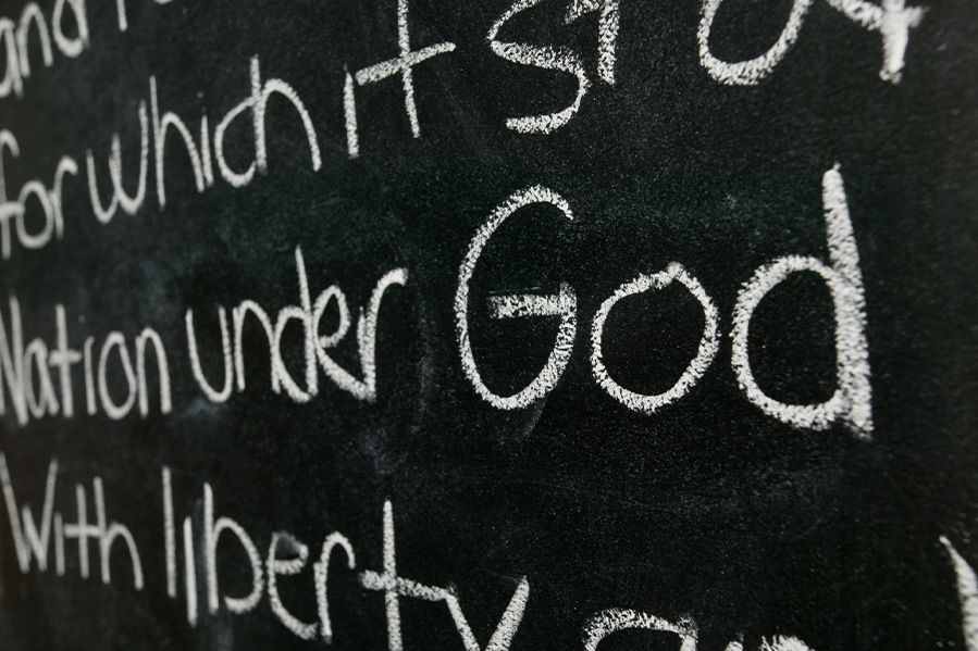 pledge of allegiance written on chalkboard