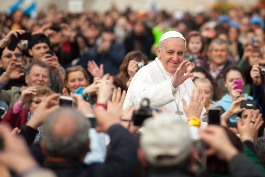 Pope Francis waving to a crowd