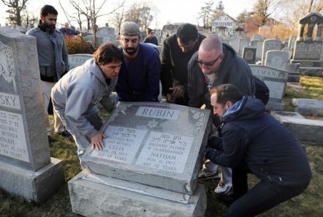 Cemetery vandalism helped to bring faith groups together to repair the damage