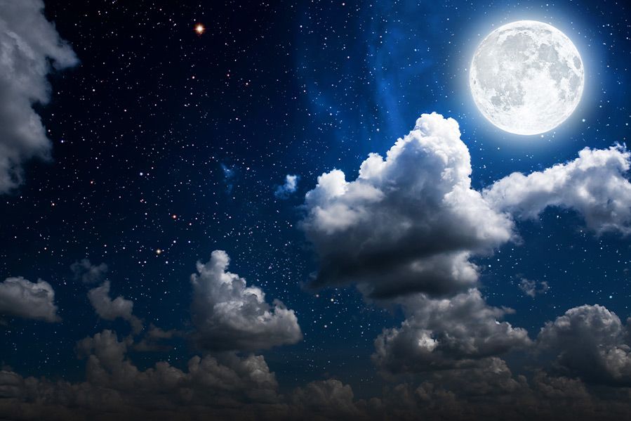 bright moon shining on clouds at night