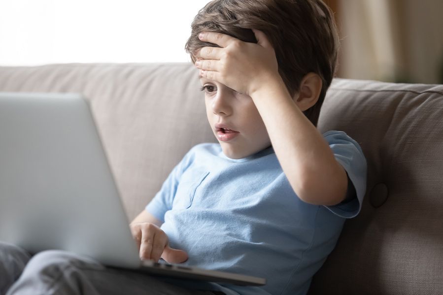 shocked child viewing porn on computer