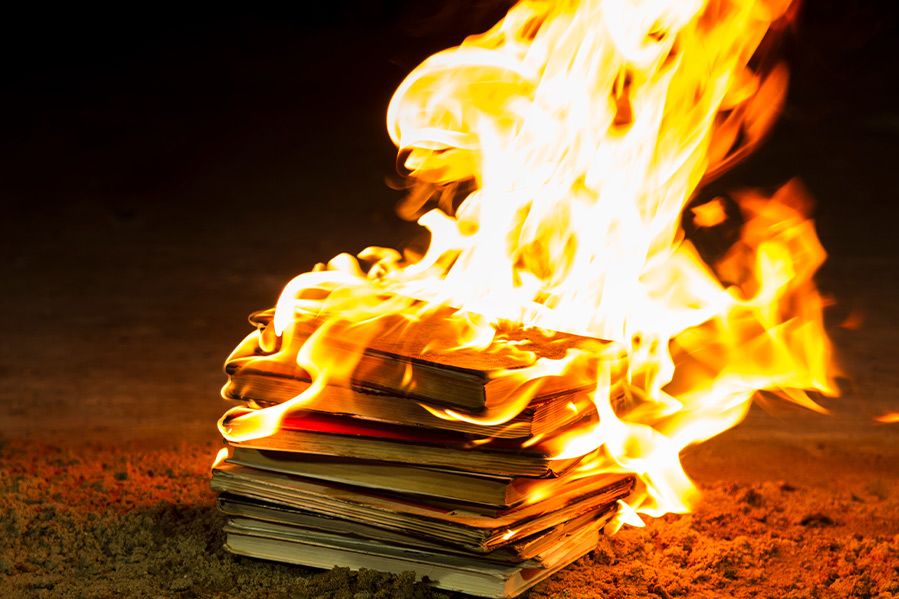 stack of books on fire