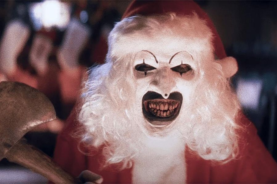 art the clown dressed as santa in terrifier three