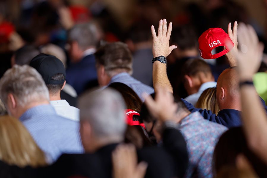 prayer in church, some congregants in Trump hats