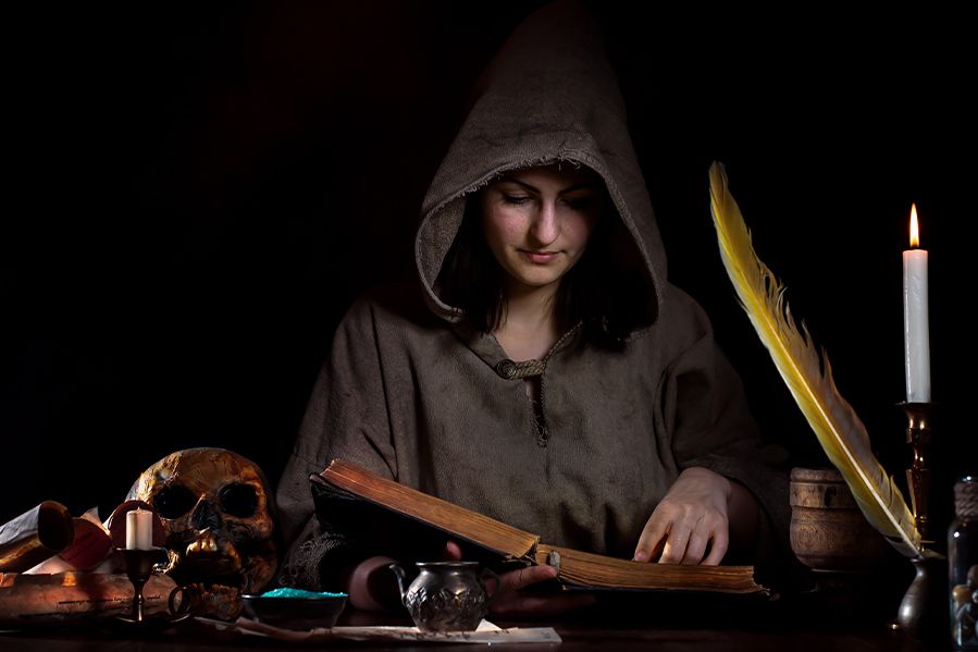 pagan woman studying magic in ancient tomb