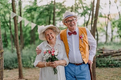 An elderly couple having their vow renewal ceremony