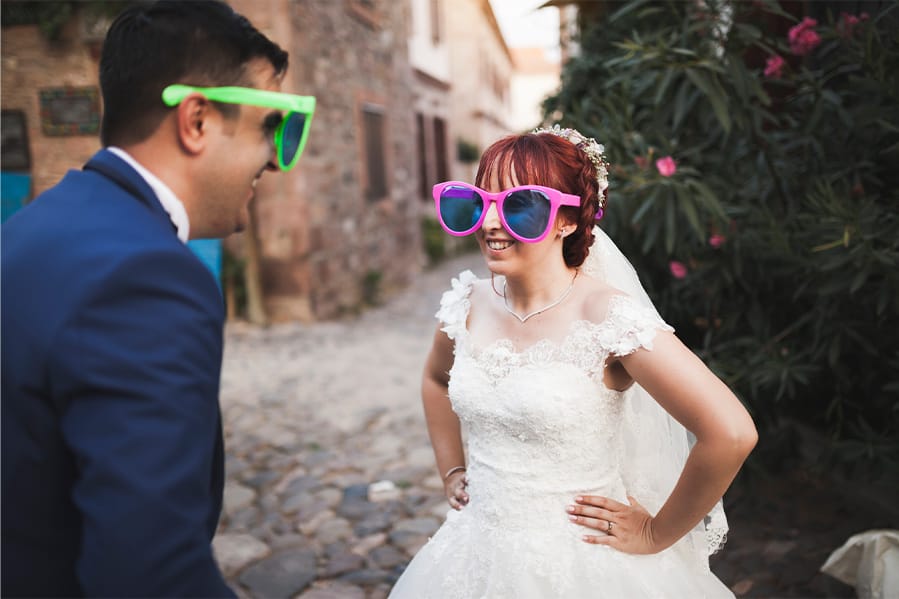 A couple having their ceremony while wearing comically large sunglasses